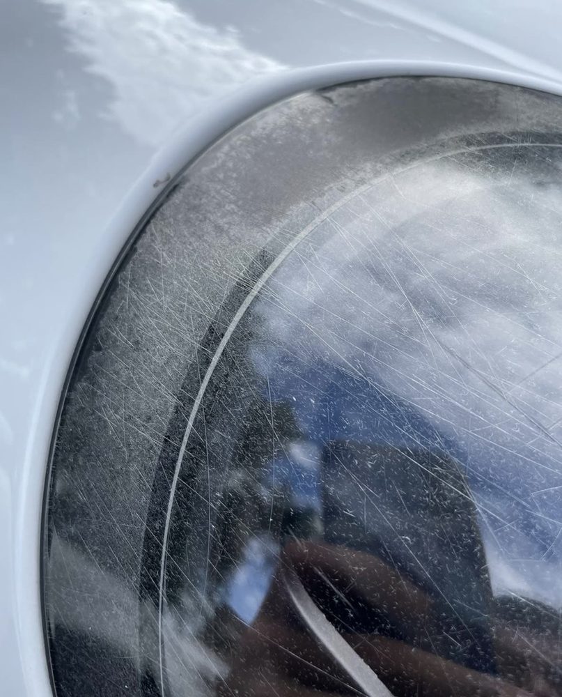 Porsche 911 headlight, before restoration, close-up of oxidation