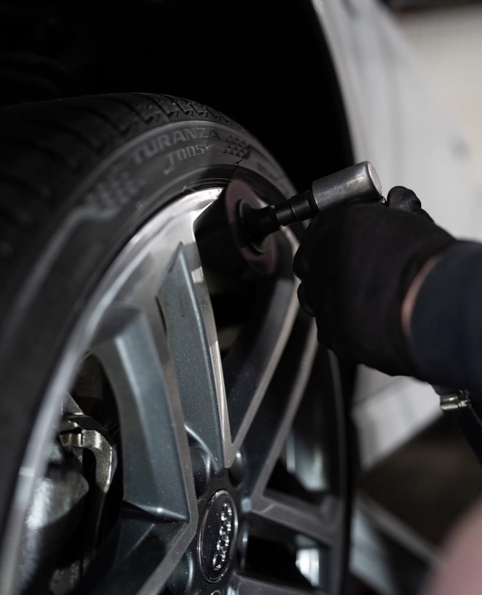 Sanding a wheel during repair